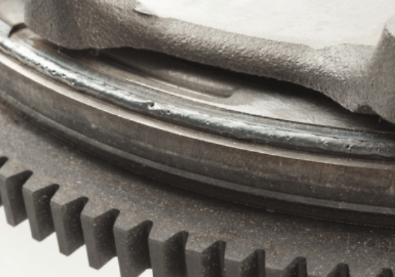 Secondary flywheel scores the primary flywheel.